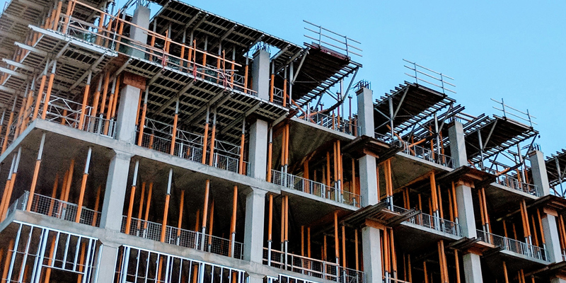 Letters of intent – how to tame the beast—Construction Law. Building under construction with heavy scaffolding.