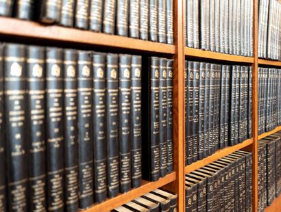 A shelf of books. Separating couples discouraged from court. FPR.