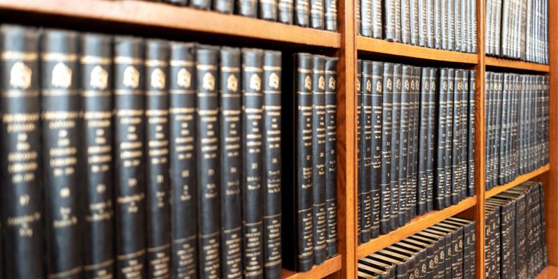 A shelf of books. Separating couples discouraged from court. FPR.