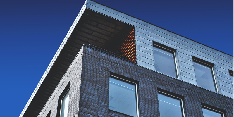 Can I stop smokers from buying a flat in my building?—The Times. The image shows an external facade of a modern residential building.