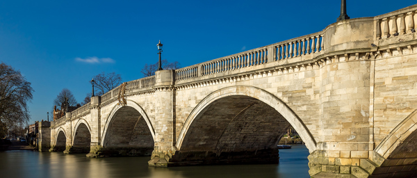Richmond bridge and the Thames. Meeting room at solicitors office in Richmond for legal consultations.