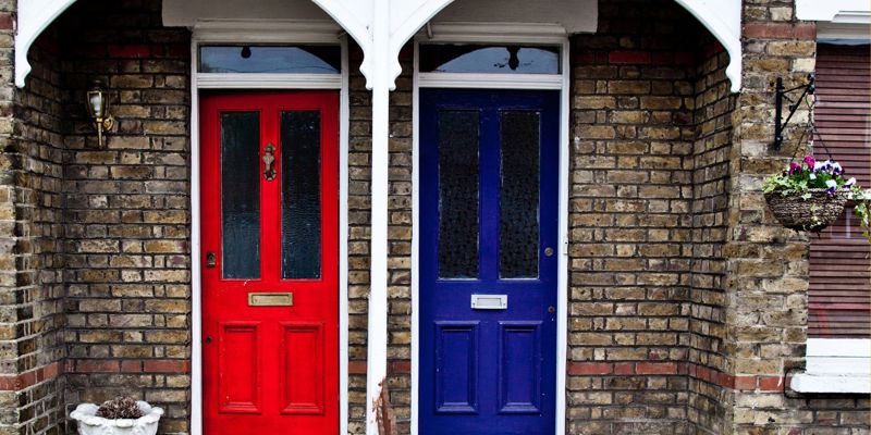 A period property with two neighbours doors, one red, the other blue. Handling noisy neighbours and disclosure of disputes—The Times Property newsletter