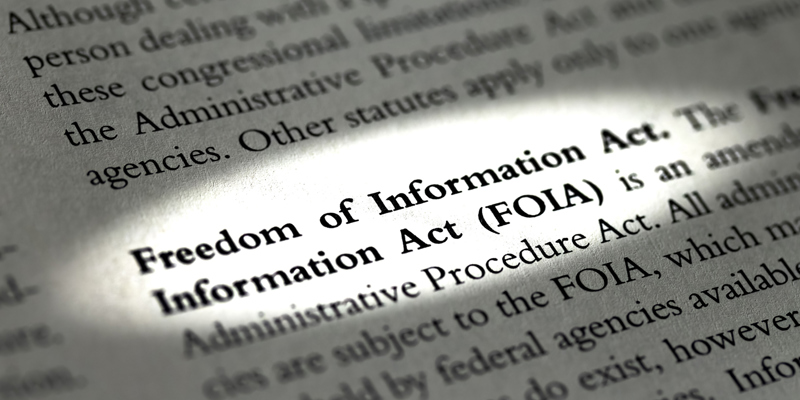 Close-up of the dictionary definition of the Freedom of Information Act (FOIA), highlighting its meaning and relevance for charities