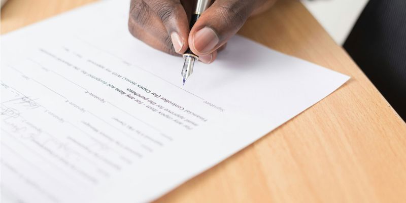 Person signing a document. Lasting Power of Attorney (LPA). Radio BBC sounds.