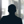 Russell-Cooke Solicitors staff photograph. Silhouette of a male team member against the backdrop of an office window with a soft focus effect.