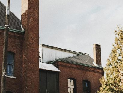 old redbrick building in city with seagull in sky. Leasehold and Freehold Reform Act 2024 (LAFRA)