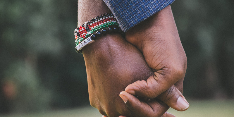 Spouses holding hands. Important changes for UK spouse visas. 