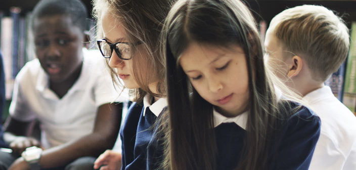 Children sat together at school. Special educational needs and disability solicitors