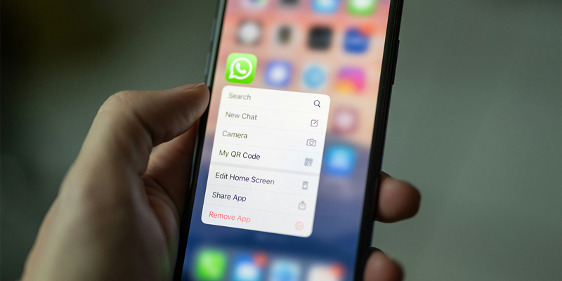 A person holding a phone with whatsapp messages. Lessons from the Post Office and Covid Inquiry—how recent scandals highlight disclosure issues in litigation